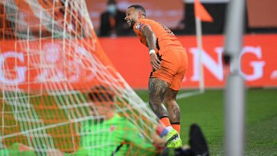 Netherlands forward Memphis Depay celebrates scoring, AFP