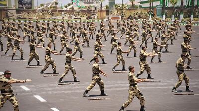 In this image released by the Egyptian President, Egyptian military soldiers perform during a medal ceremony, at a military base east of Cairo, Egypt, Thursday, July 5, 2012. A Palestinian official says Gaza's prime minister will head to Cairo within the next two weeks to meet with Egypt's new Islamist president, who has close ties with the territory's Hamas rulers. (AP Photo/Mohammed Abd El Moaty, Egyptian Presidency)