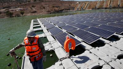Solar panels are seen during the inauguration of world's first-ever 'island' of solar panels in a tailings pond of the Los Bronces copper mine of Anglo American, on the outskirts of Santiago, Chile. REUTERS