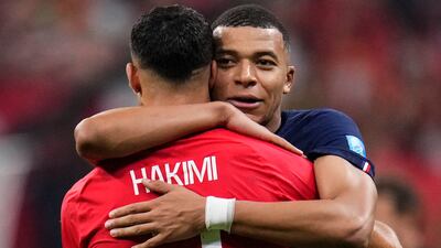 France's Kylian Mbappe hugs Morocco's Achraf Hakimi. AP