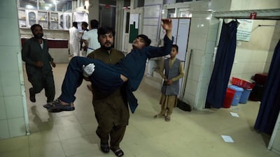 An Afghan man who was injured when militants attacked a prison in Jalalabad on Sunday is carried to hospital. EPA