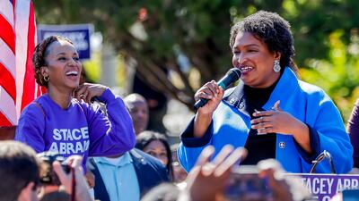 Polls show Ms Abrams, campaigning with Washington in Stone Mountain, in a dead heat with Republican incumbent Brian Kemp. EPA