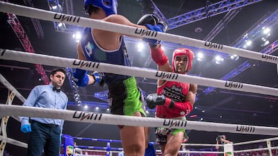 Ilyass Habibali of UAE, in red, defeats Mustafa Al Tekreet of Iraq.