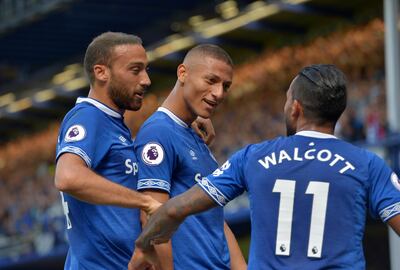 Richarlison, centre, and Theo Walcott, right, scored the goals for Everton against Southampton. Reuters