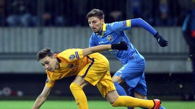 Munir El Haddadi of Barcelona fends off a challenge from Filip Mladenovic of Bate Borisov during their Champions League contest on Tuesday night. Tatyana Zenkovich / EPA