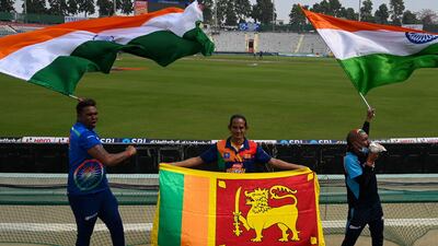 India and Sri Lanka fans waves flags on the eve of first Test at the Punjab Cricket Association Stadium in Mohali. AFP