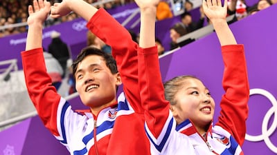 North Korea's Ryom Tae Ok (R) and North Korea's Kim Ju Sik react after the pair skating free skating of the figure skating event. Mladen Antonov / AFP