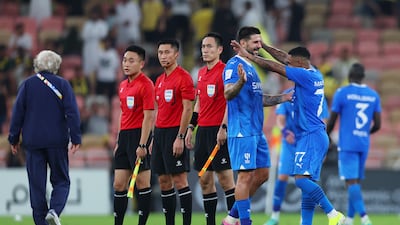 Aleksandar Mitrovic and Malcom embrace at full-time following Al Hilal's victory over Al Ittihad. Getty Images