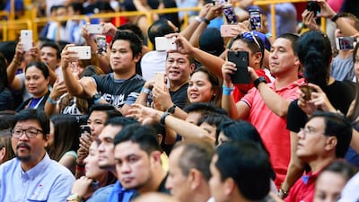 Fans of Manny Pacquiao’s basketball team, Mahindra Enforcer take selfies and pictures at the Al Wasl Sports Club. Victor Besa for The National