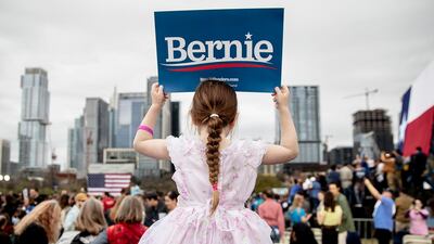 Lily Barbour, 5, holds up a campaign sign for Democratic presidential candidate Sen. Bernie Sanders, I-Vt., during a campaign event in Austin, Texas, Sunday, Feb. 23, 2020. (Nick Wagner/Austin American-Statesman via AP)