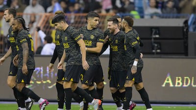 Lionel Messi is congratulated by his PSG teammates after opening the scoring.