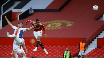 Manchester United substitute Mason Greenwood (R) heads a chance wide. AFP