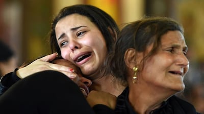Women mourn for the victims of the blast at Alexandria's Saint Mark's Cathedral during a funeral procession at the Monastery of Marmina in the city of Borg El Arab, east of Alexandria, on April 10, 2017. Mohamed El Shahed / AFP