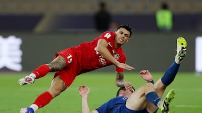 Shabab Al Ahli's Matuesao battles for possession with Curtis Good of Buriram United. Getty Images