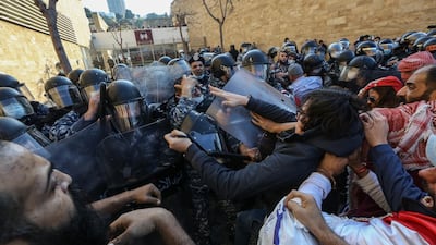 Lebanese policemen and students at the American University of Beirut (AUB) clash during a protest in front of the university over an effective tuition fee hike caused by the changing of the exchange rate from Lebanese lira to US dollar. EPA