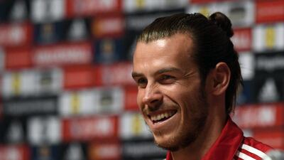 Gareth Bale speaks at a news conference ahead of Thursday's Group B clash with England. Stu Forster / Getty Images