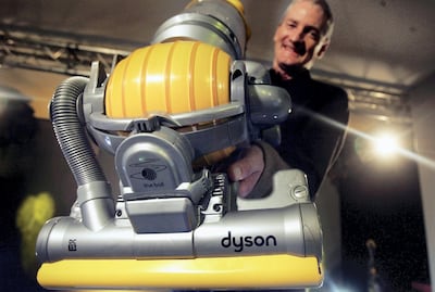 James Dyson demonstrates his latest hoovering invention in London in 2005. Getty Images