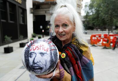 Vivienne Westwood holds a ball with a word "justice" written on it outside the Old Bailey, the Central Criminal Court ahead of a hearing to decide whether Assange should be extradited to the United States. Reuters.