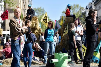 Activists from Extinction Rebellion block a boulevard in Paris during a protest on Saturday. AFP