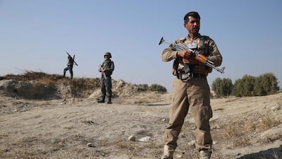 Afghan security officials stand guard at a checkpoint on the outskirts of Jalalabad, Afghanistan, on December 30, 2019. EPA