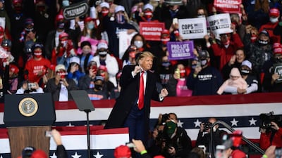 President Donald Trump dances to music during a campaign rally at the John Murtha Johnstown-Cambria County Airport in Johnstown, Pa., Tuesday, Oct. 13, 2020. (John Rucosky/The Tribune-Democrat via AP)