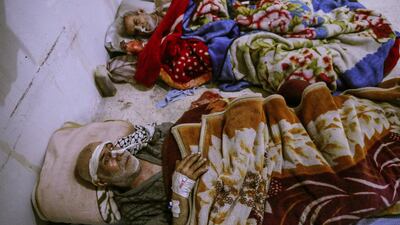 Injured people receive medical attention inside a hospital after bombs fell on rebel-held Douma, Eastern Ghouta. Mohammed Badra / EPA