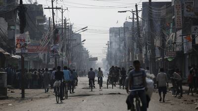 People ride on their bicycle on the motorway connecting Nepal to India during a general strike called by Madhesi protesters demonstrating against the new constitution in Birgunj, Nepal. Navesh Chitrakar / Reuters