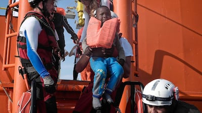 A rescued child is transferred to the MV Aquarius rescue boat off Libyan coast. The 74 migrants of various nationalities, including women and children were rescued by MV Aquarius, a rescue vessel chartered by SOS-Mediterranee and Doctors Without Borders. Louisa Gouliamaki / AFP