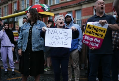 Anti-racism protesters at a mosque in Liverpool, on August 2. People of all faiths or none have come out to stand with their Muslim neighbours. EPA