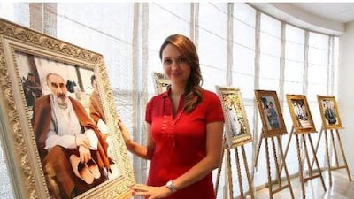 Hermoine Macura with some of her work at the Faces of the Middle East exhibition in Dubai earlier this week.