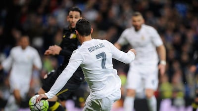 Cristiano Ronaldo of Real Madrid scores Real’s 2nd goal during the La Liga match between Real Madrid CF and Sevilla FC at Estadio Santiago Bernabeu on March 20, 2016 in Madrid, Spain. (Photo by Denis Doyle/Getty Images)