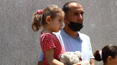 A family made homeless after their building, the Hanadi highrise, was destroyed by Israeli air strikes. Rakan Abed El Rahman for The National