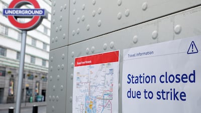 A poster details a separate strike by Tube workers, outside Victoria underground station in London. Reuters