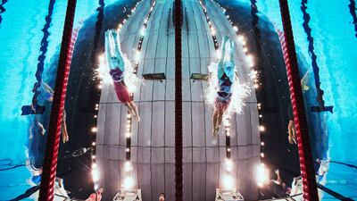 Russian swimmer Anastasiia Gontar, left, and Aurelie Rivard of Canada compete during the women's 100m freestyle - S10 heat at the Tokyo Aquatics Centre during the Paralympic Games on August 25. Getty