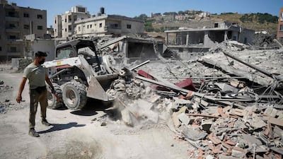 A bulldozer clears the rubble of buildings destroyed in Israeli strikes in the southern Lebanese city of Nabatieh. AFP