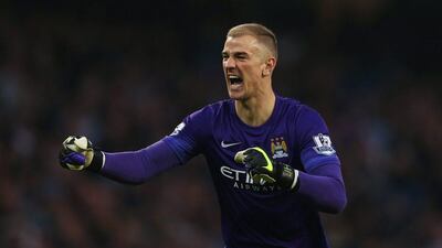 Joe Hart celebrates Manchester City's win over Norwich at the final whistle. Chris Brunskill / Getty Images