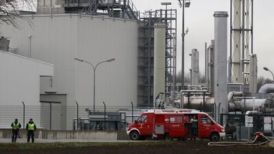 Firefighters stand outside a gas plant after an explosion occurred near Baumgarten. Ronald Zak / AP Photo