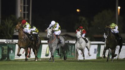 Rakha, far, left, ridden by Silvestre de Sousa, and Sha'Red, second left, ridden by James Doyle, race to a dead heat at Abu Dhabi Equestrian Club in Abu Dhabi on February 2, 2013. Lee Hoagland / The National