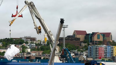 Debris from the Titan submersible, recovered from the ocean floor near the wreck of the Titanic, is unloaded from a ship in St John's, Newfoundland. All photos: AP