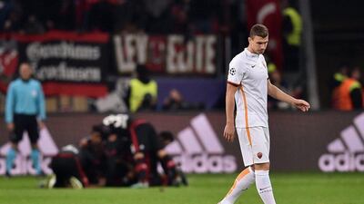 Edin Dzeko of AS Roma reacts after Bayer Leverkusen's equaliser in their Champions League contest on Tuesday night. Dennis Grombkowski / Bongarts / Getty Images / October 20, 2015