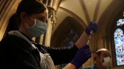 A healthcare worker prepares a Covid-19 vaccine inside Lichfield Cathedral, which had been turned into an emergency vaccination centre amid the coronavirus disease outbreak, January 15, 2021. File photo / Reuters
