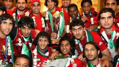 The UAE Under-19s football team show off their trophy on returning home last night as Asian Football Confederation champions. Hamdan al Kamali, holding the trophy, captained his side to a 2-1 victory over Uzbekistan in Saudi Arabia on Friday to clinch the title.