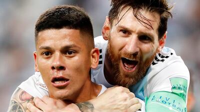 Marcos Rojo, left, and Lionel Messi celebrate after Rojo scored the winner for Argentina against Nigeria in their Group D match. EPA