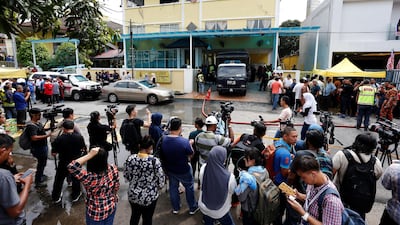 Media crowd outside religious school Darul Quran Ittifaqiyah after a fire broke out in Kuala Lumpur, Malaysia. Lai Seng Sin / Reuters