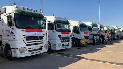 Iraqi trucks wait to cross into Saudi. Reuters