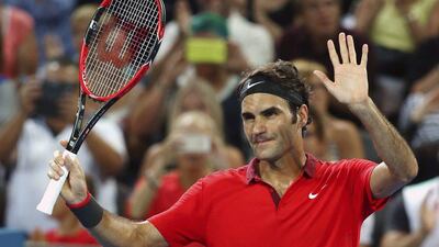 Roger Federer waves at the crowd after he won his quarter final match against James Duckworth 6-0, 6-1 during the Brisbane International tournament, on Friday, Jan. 9, 2015. Tertius Pickard/AP Photo