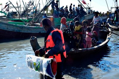Myanmar Navy personnel escort Rohingya Muslims back to their camp in Sittwe, Rakhine state, on November 30, 2018. AFP