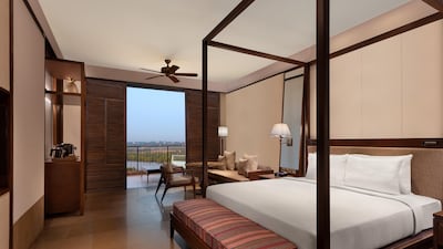 The King River View room comes with a four-poster bed