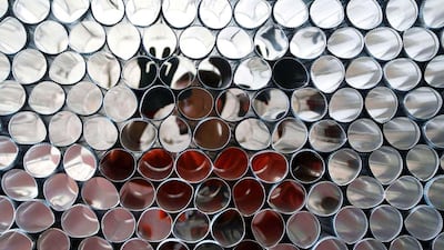 A man arranges metal tubes that are part of a Sobia, a diesel heater, prior to winter season in Sidon, south Lebanon on October 25, 2014. Ali Hashisho / Reuters