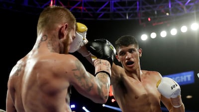 Sebastian Fundora, right, punches Daniel Lewis, of Australia, during their super welterweight boxing match in Las Vegas. AP